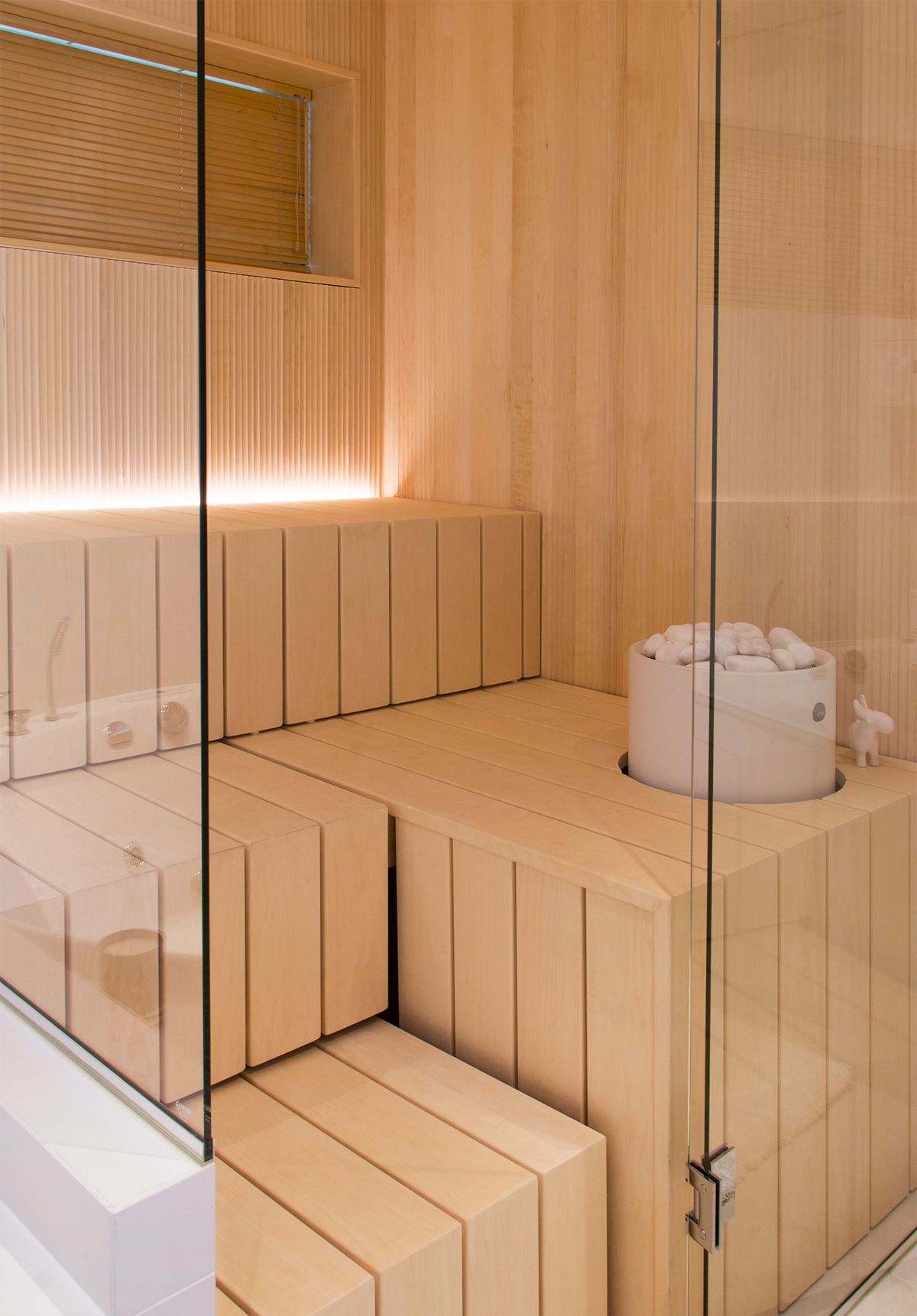 Atmospheric sauna lighting. Led strip behind the bench illuminating from bottom to top. Ledstore.fi
